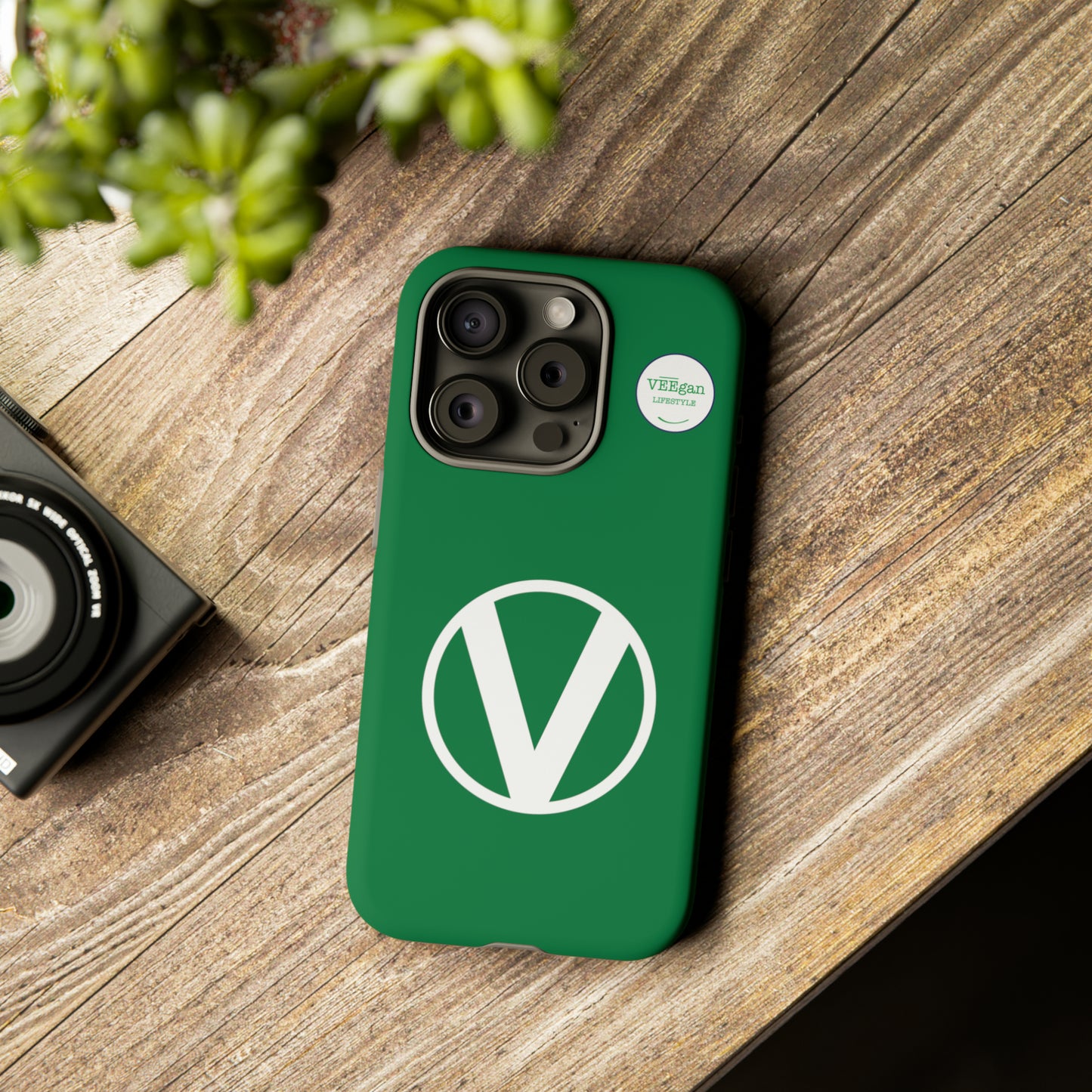 front view "Circle-V" green tough phone case on office desk