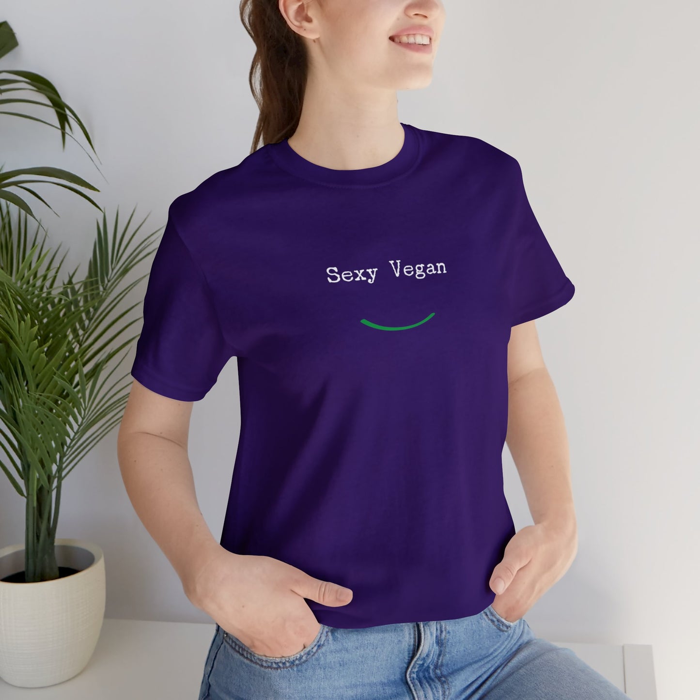 front "Sexy Vegan" purple t-shirt with smile on female lifestyle 