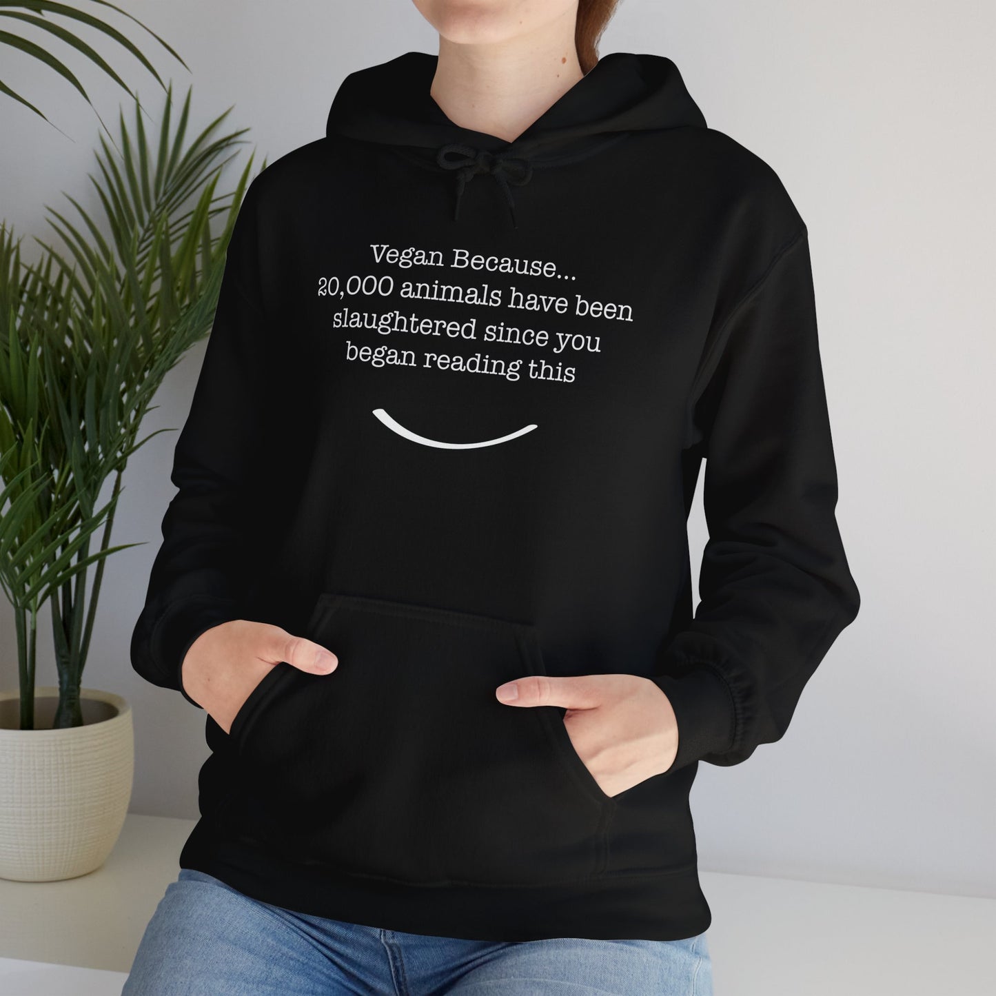 front view "Vegan Because 20,000 animals have been slaughtered since you began reading this" black hoodie lifestyle view female