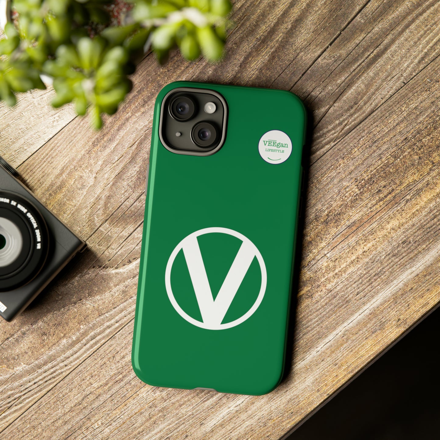 front view "Circle-V" green tough phone case on office desk