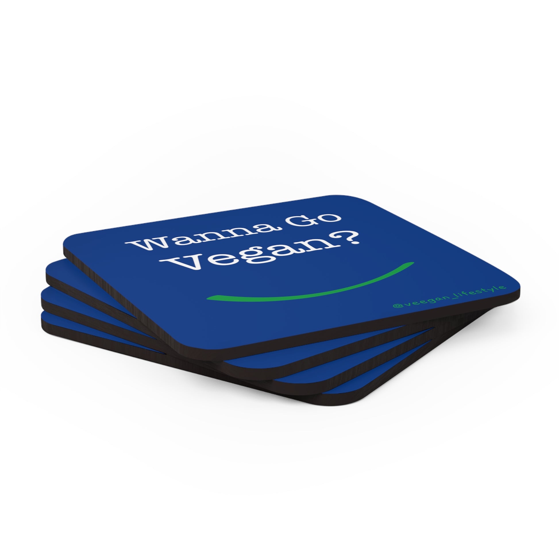 front view "Wanna Go Vegan?" blue cork square coaster set on white background