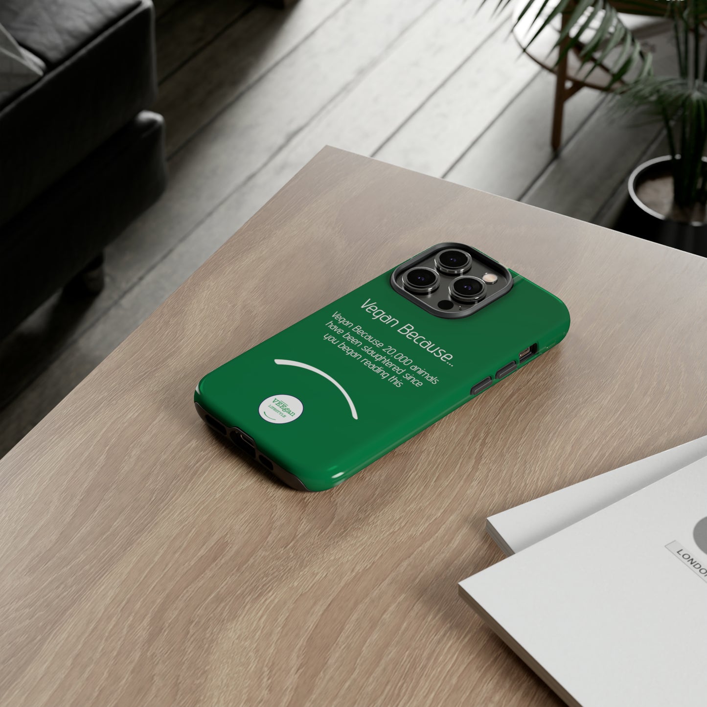 front view "Vegan Because 20,000 animals have been slaughtered since you began reading this" green touch phone case in office environment