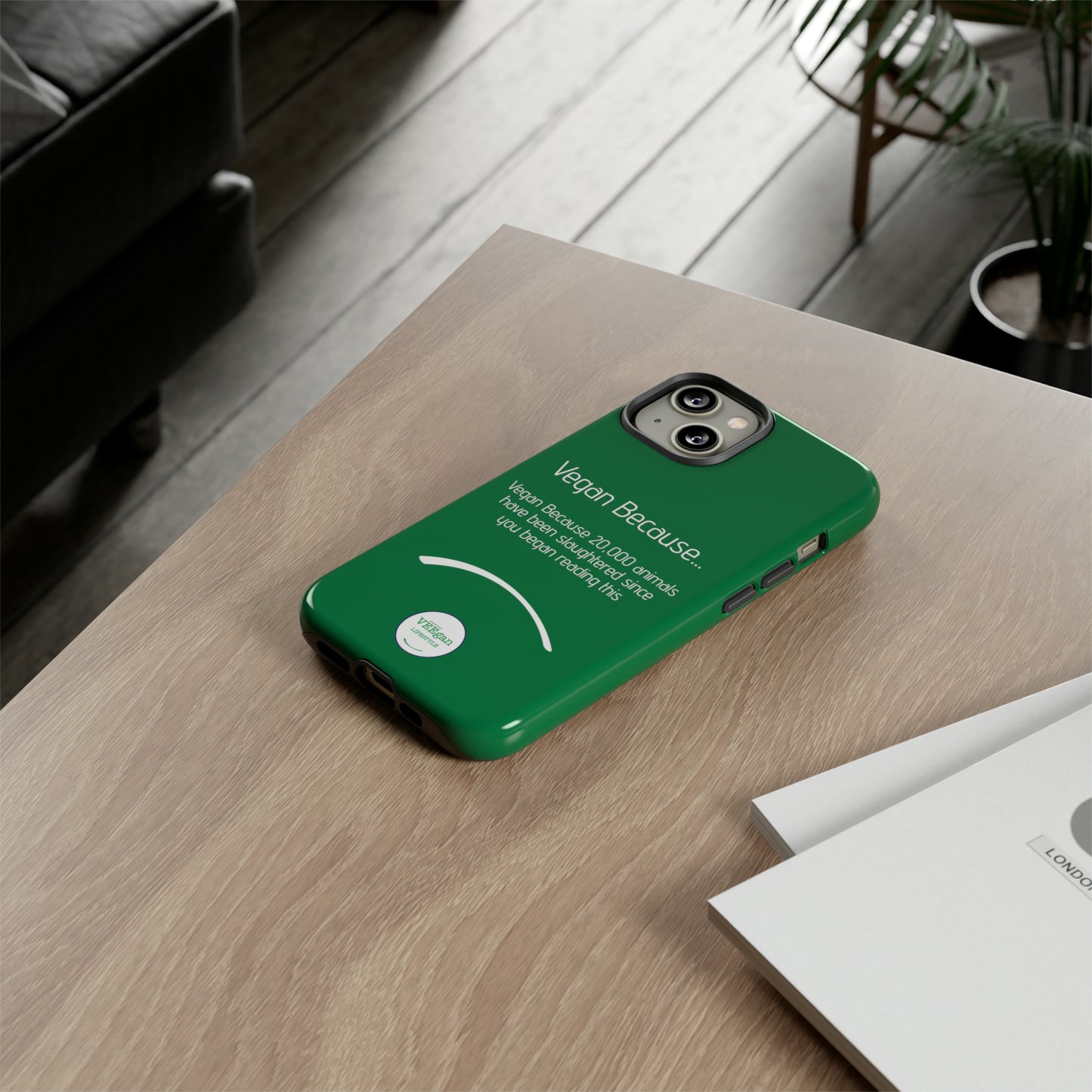 front view "Vegan Because 20,000 animals have been slaughtered since you began reading this" green touch phone case in office environment