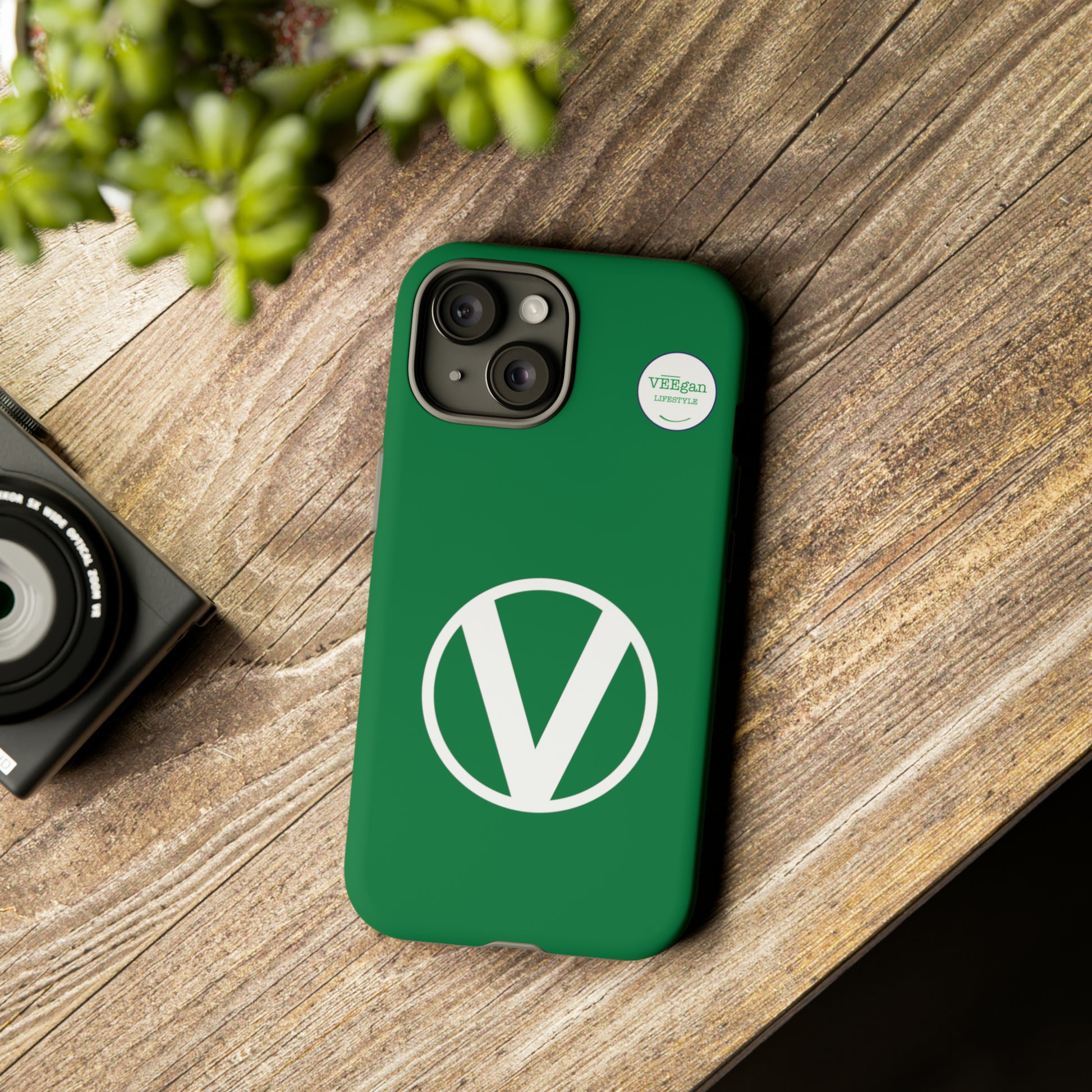 front view "Circle-V" green tough phone case on office desk