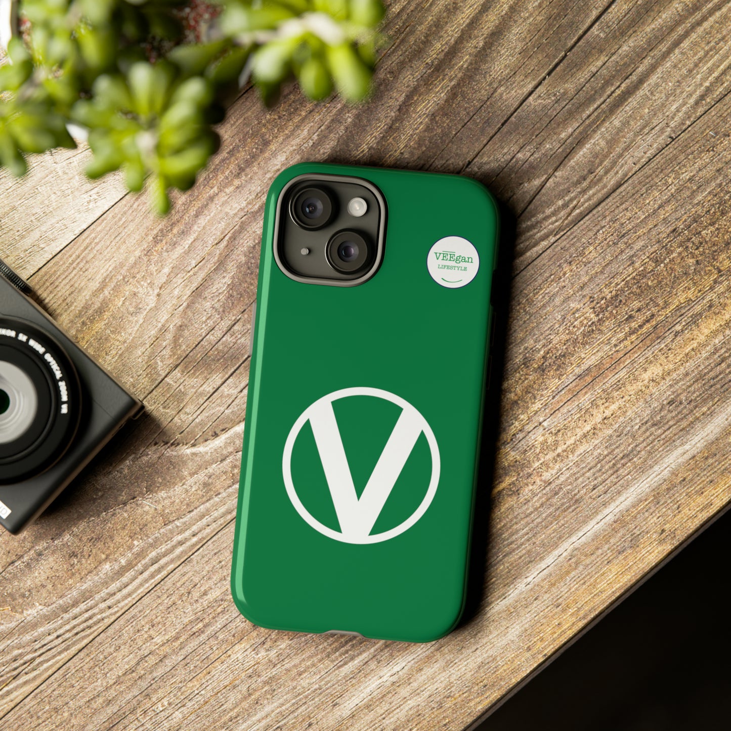 front view "Circle-V" green tough phone case on office desk