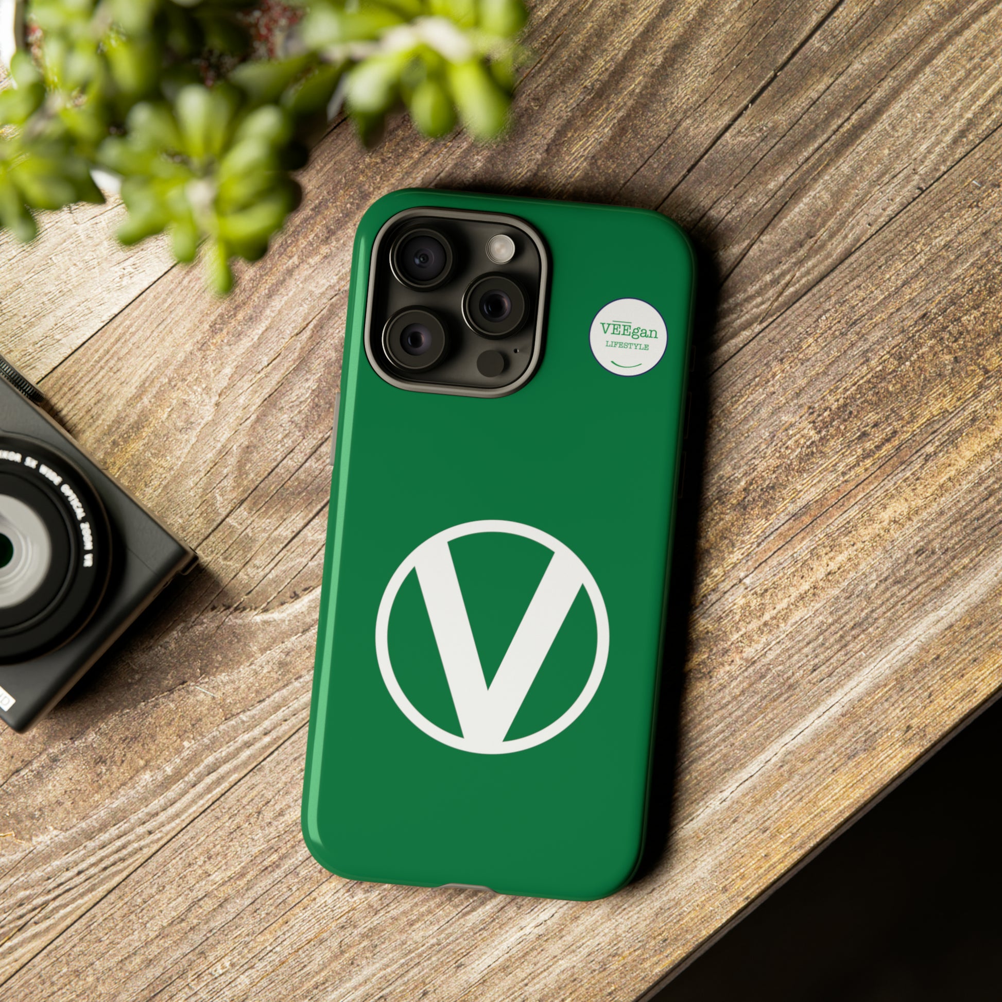 front view "Circle-V" green tough phone case on office desk