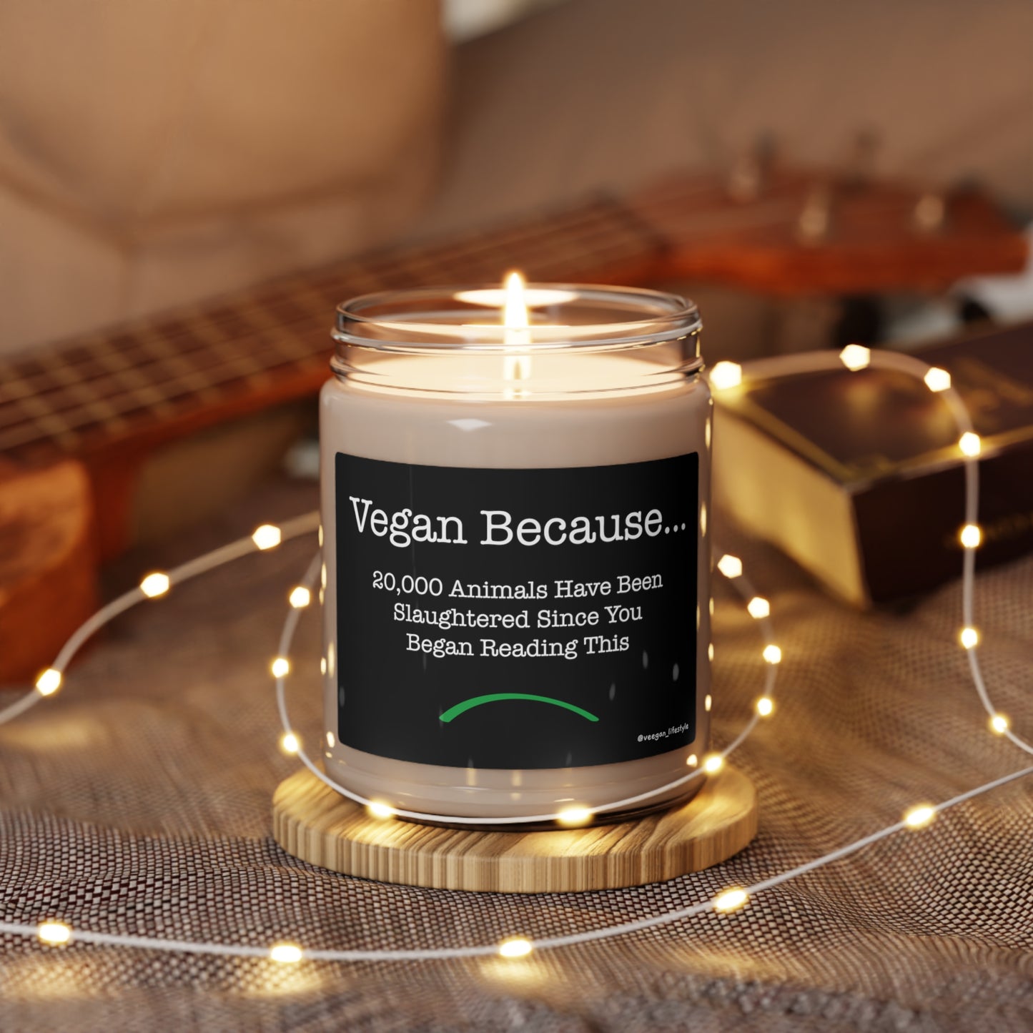 front view "Vegan Because 20,000 animals have been slaughtered since you began reading this" scented candle romantic setting