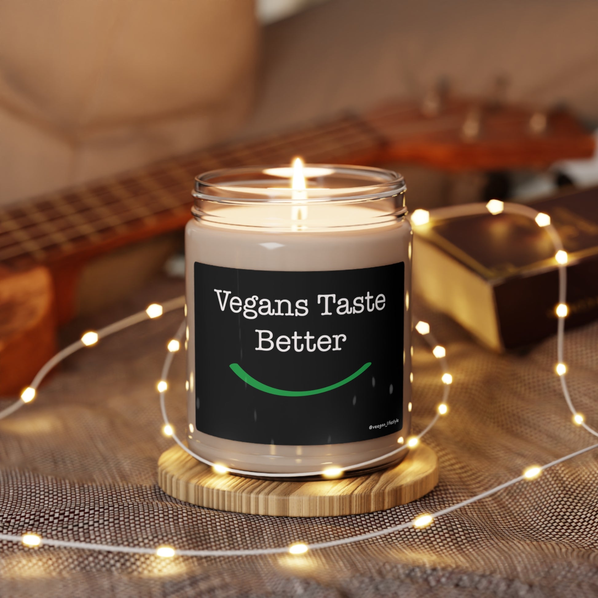 front view "Vegans Taste Better" scented candle in romantic setting