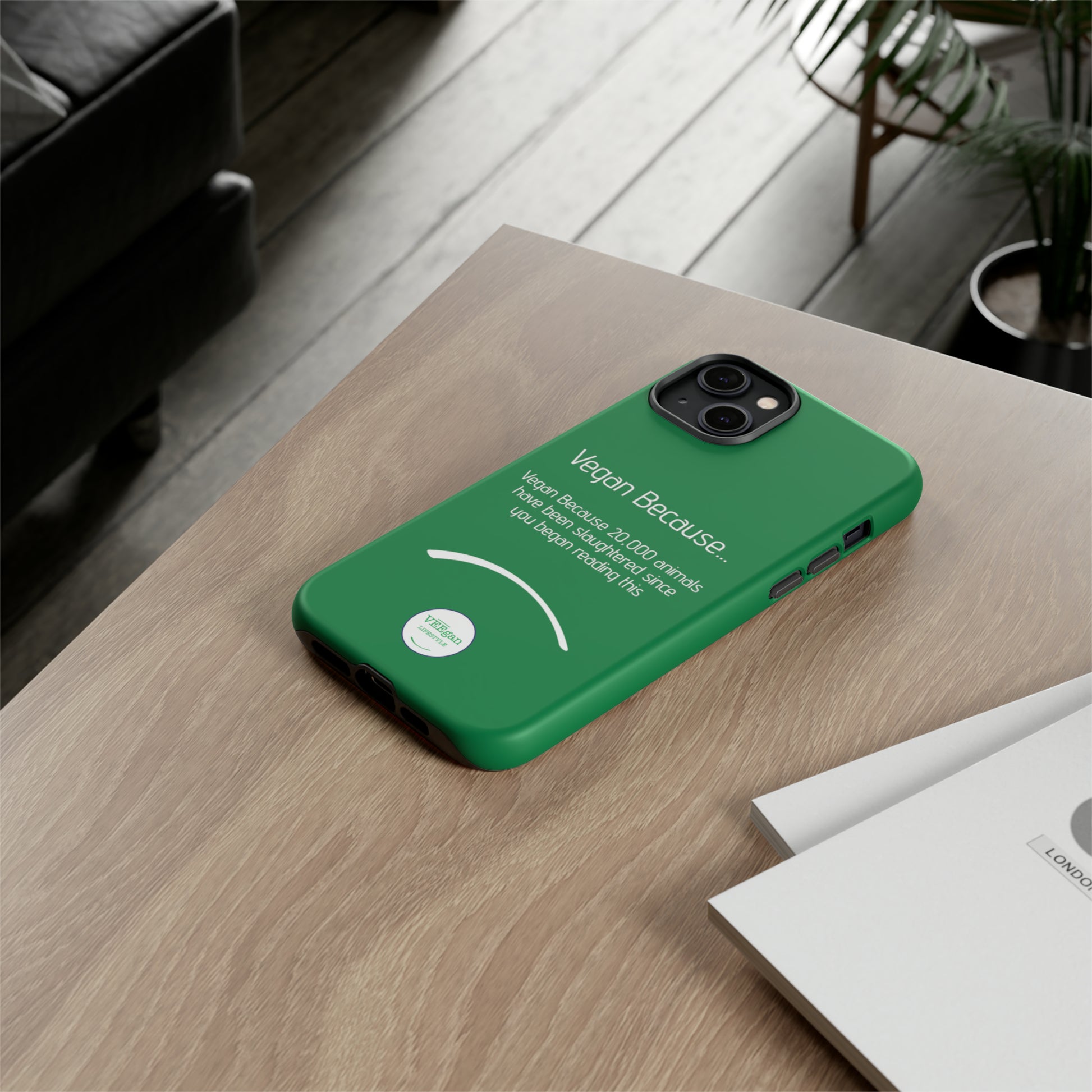 front view "Vegan Because 20,000 animals have been slaughtered since you began reading this" green touch phone case in office environment